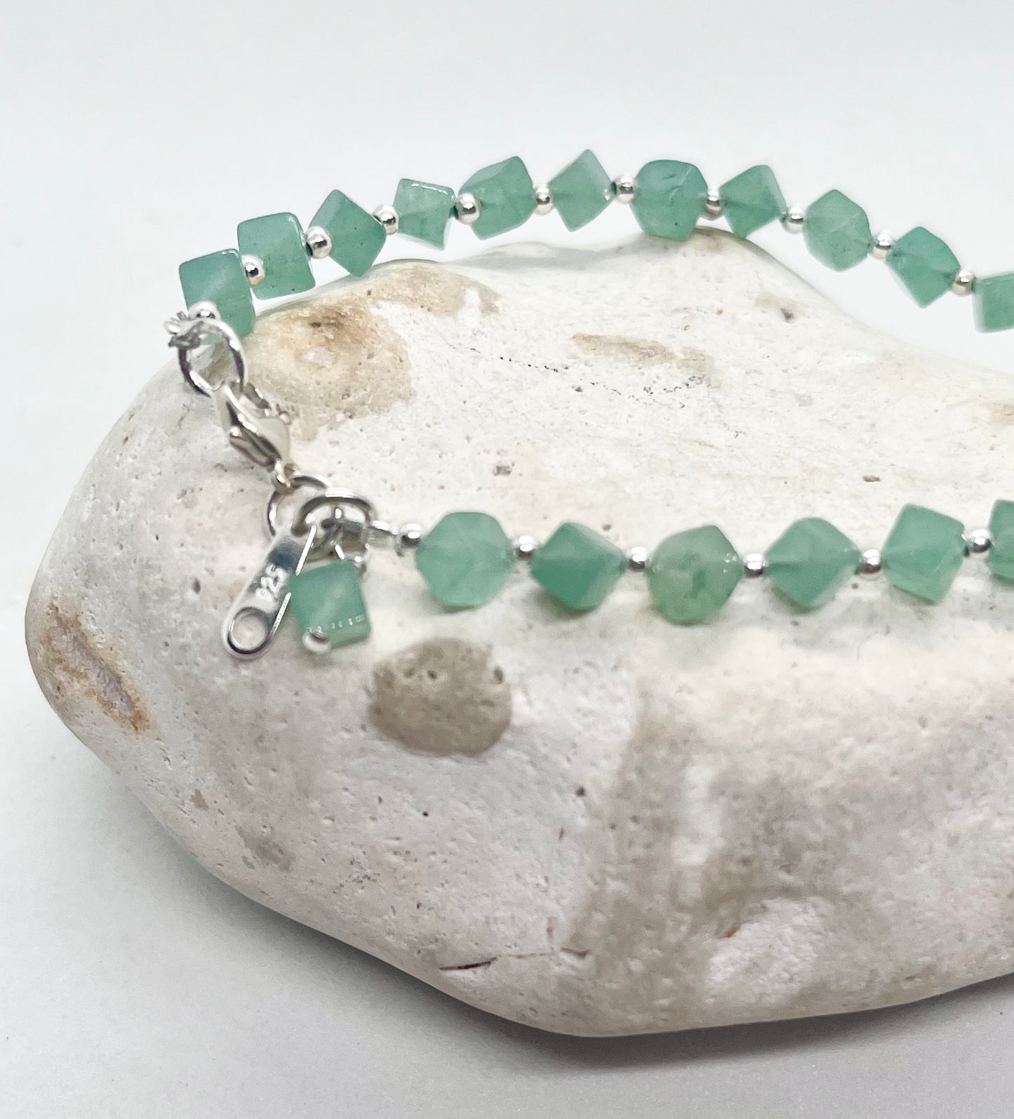 Green crystal beaded bracelet with charms and silver beads