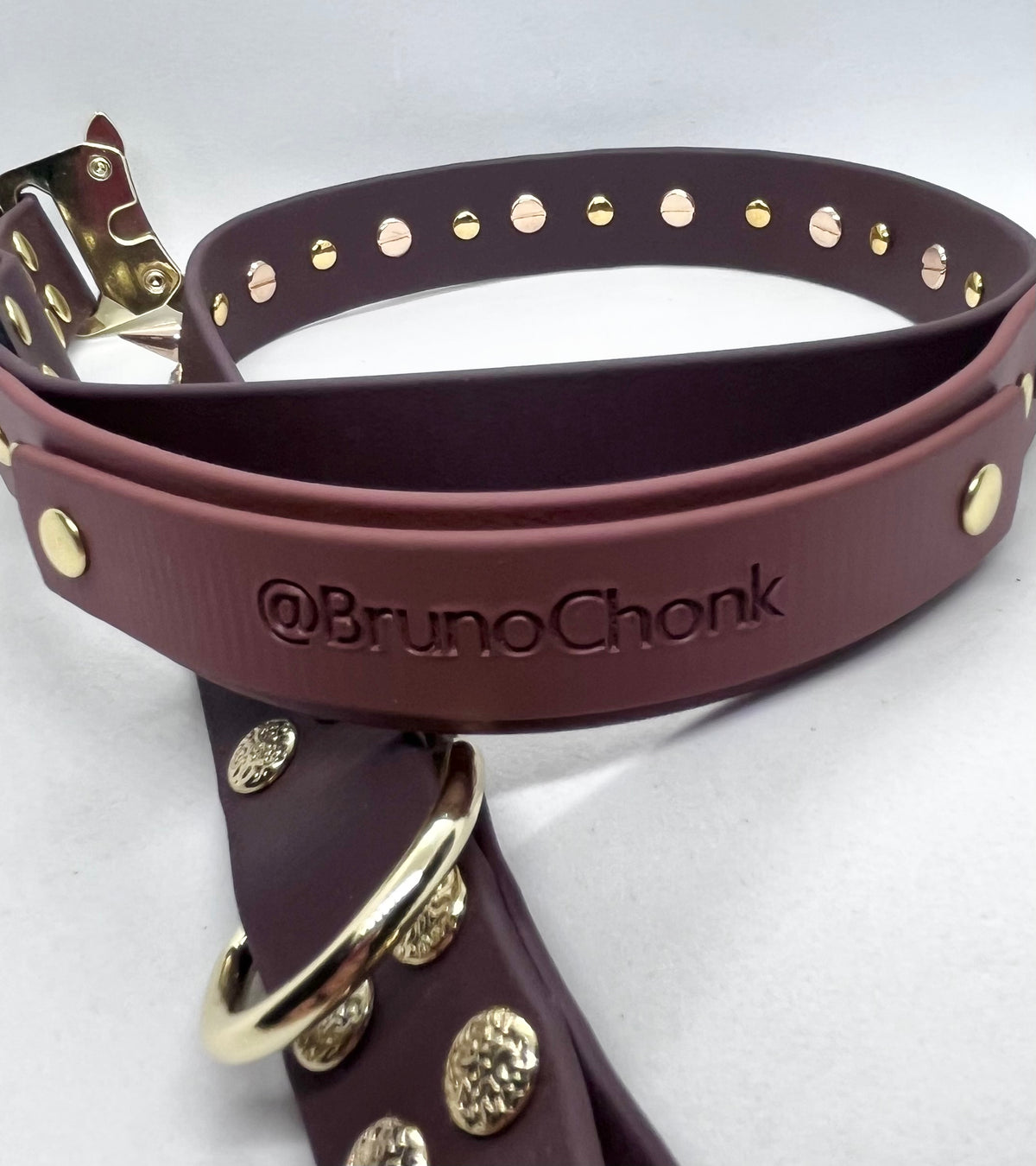 Two-tone brown BioThane® dog collar with an embossed @BrunoChonk handle and gold-toned hardware