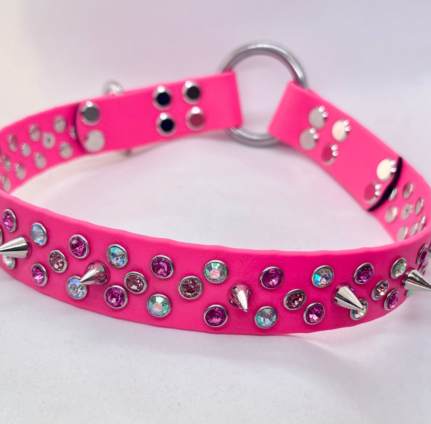 Neon pink rhinestone crystal BioThane dog collar laid flat showing full width and mixed stud detail
