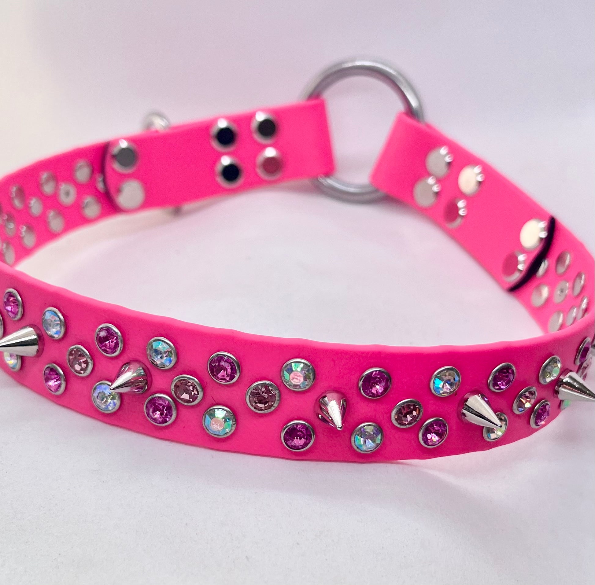 Neon pink rhinestone crystal BioThane dog collar laid flat showing full width and mixed stud detail