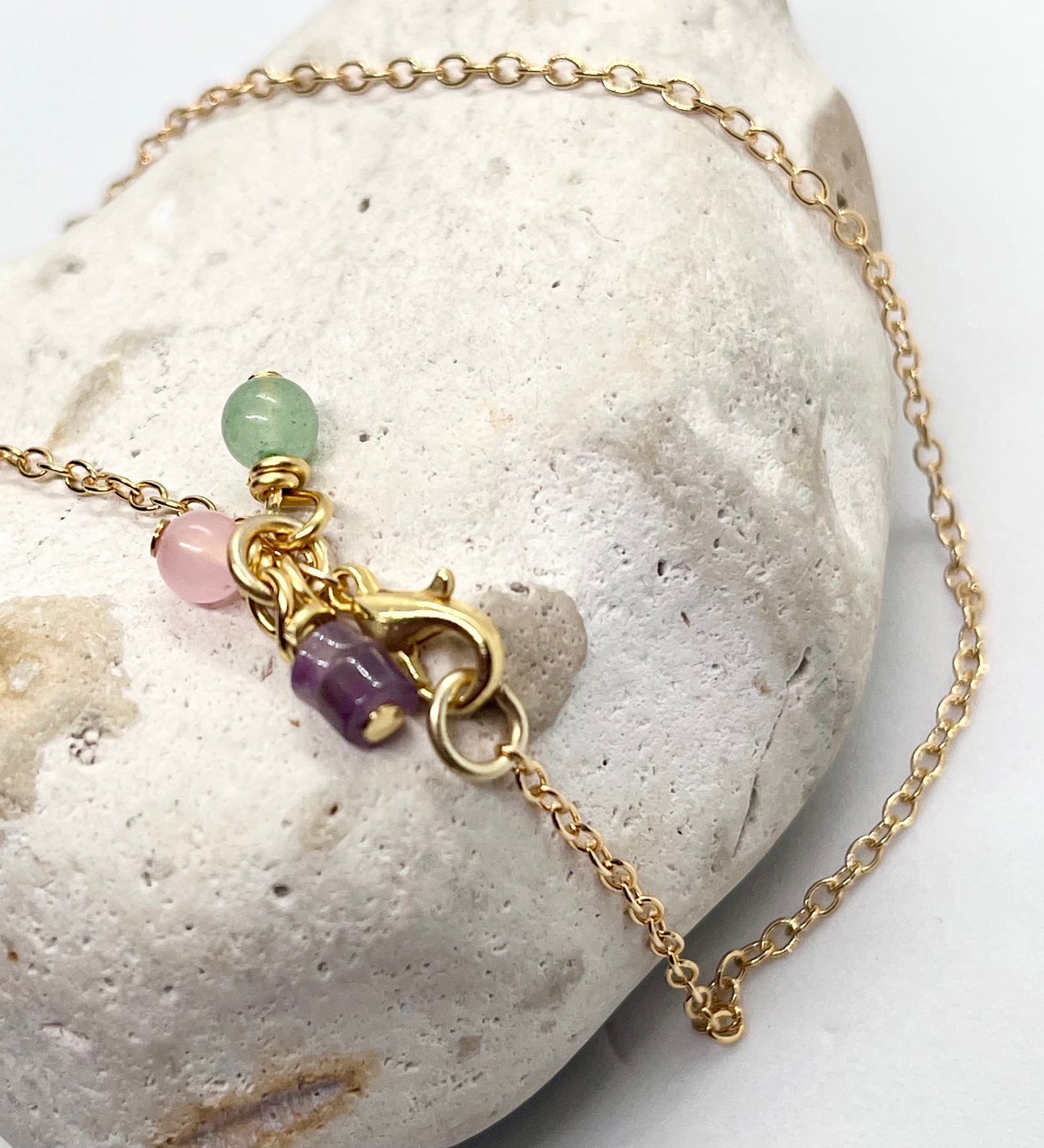 Gold cable bracelet with crystal charms